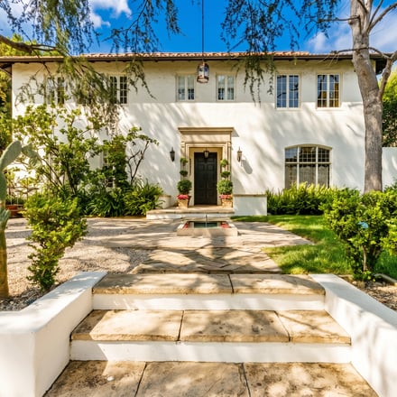 Film crew shooting in stylish Los Angeles living room
